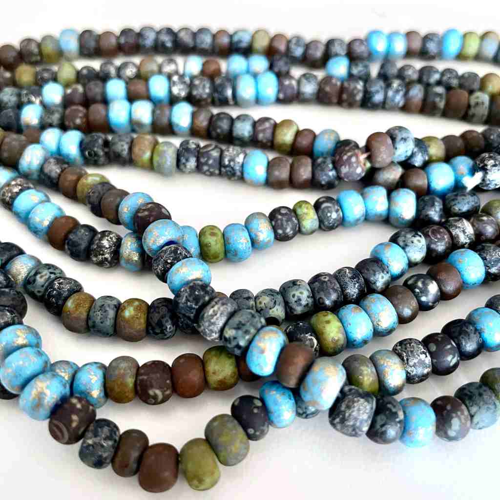 large seed beads with an aged finish in earthy tones with a touch of turquoise