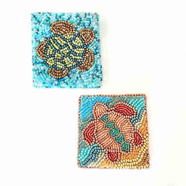 square panel embroidered with seed beads to create a picture of a turtle