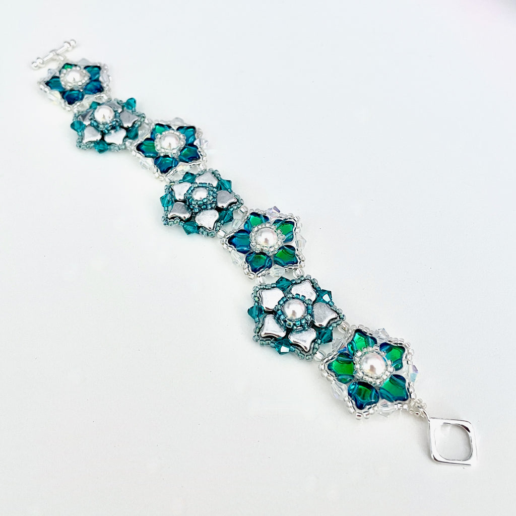  Eden Beaded bracelet with silver and teal flowers with silver toggle/Island Cove Beads & Gallery