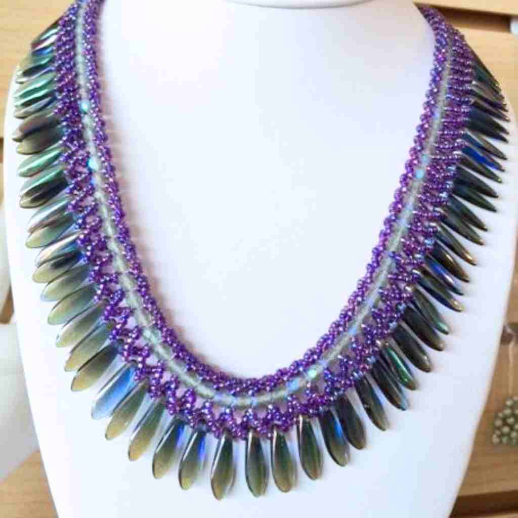 purple and green beaded collar style necklace