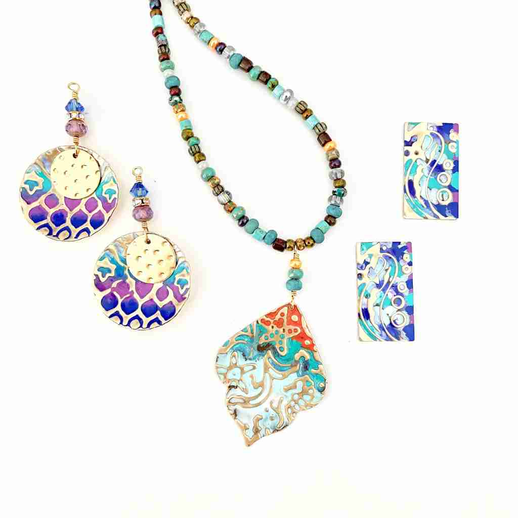 painted metal embossed pendants and earrings