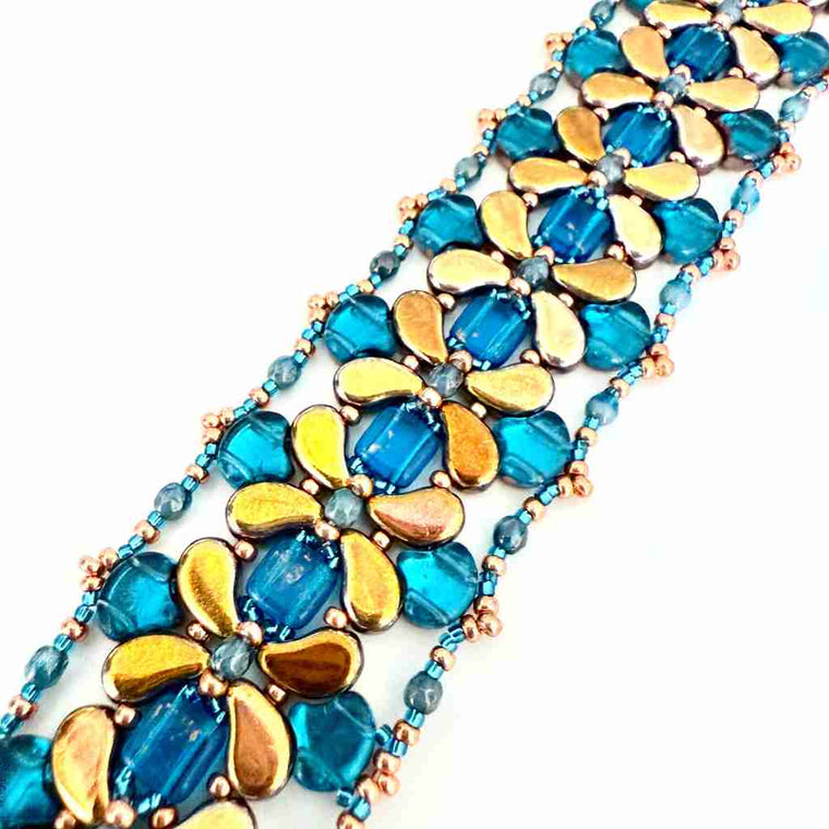 Beaded bracelet with paisley shaped beads in teals and gold colors