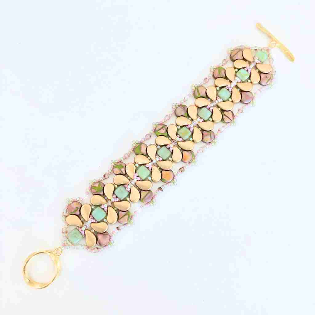 Bracelet with multicolored paisley shaped beads on a white background