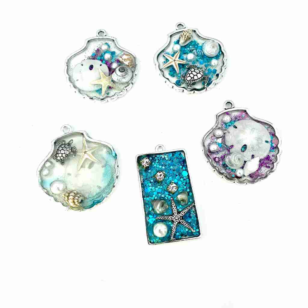 resin with shells and glitter in shell shaped pendant