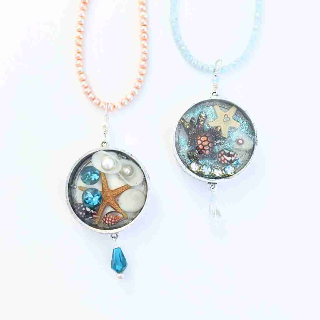 resin pendat with metal bezel, shells, starfish and pearls