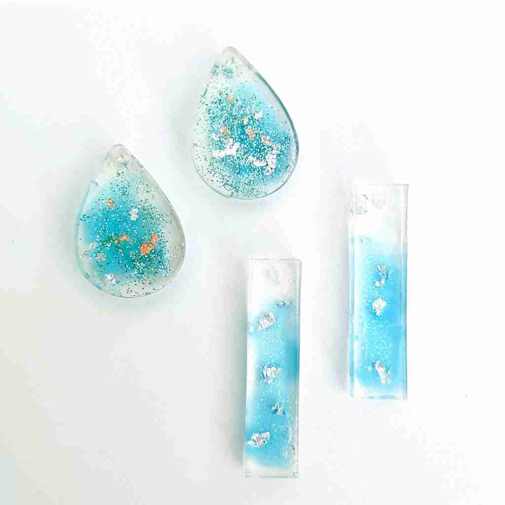 Aqua blue and silver molded resin pendants