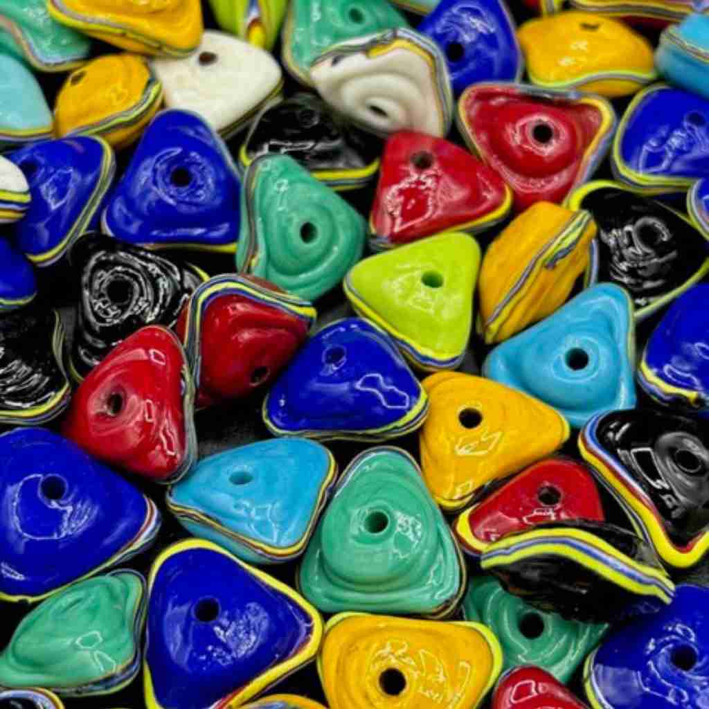 brightly colored triangle shaped venetian glass beads
