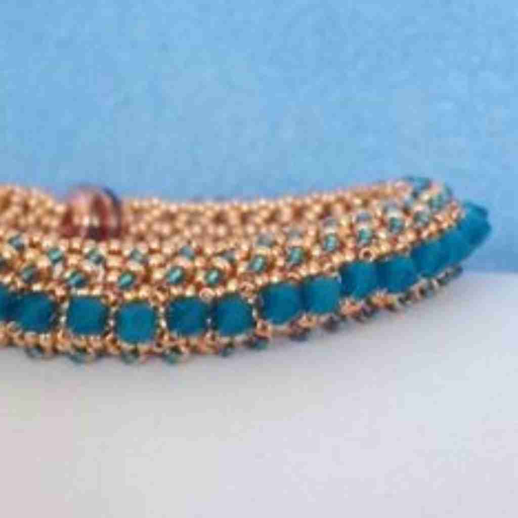 gold seed beaded bracelet with carribean blue swarovski crystals