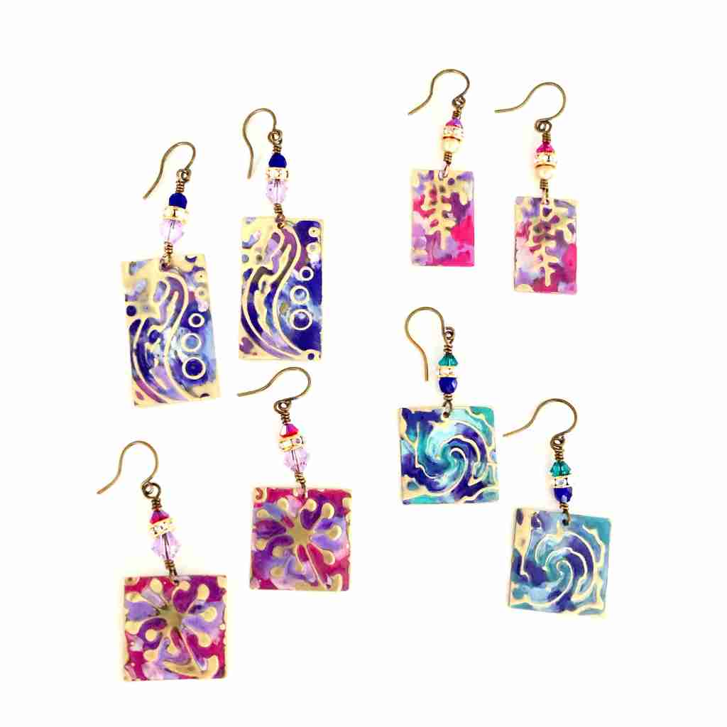 four pairs of colorful metal embossed earrings