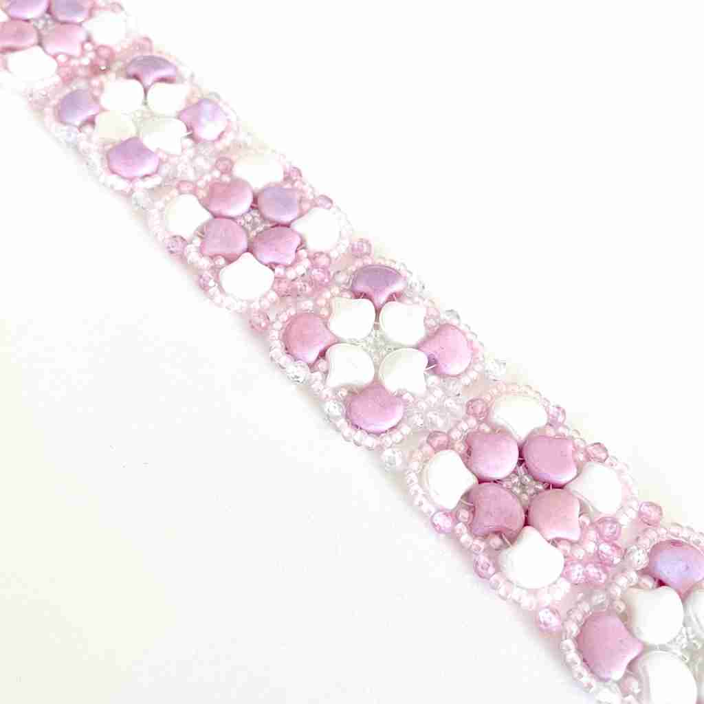 pink and white ginko beads in a stitched bracelet