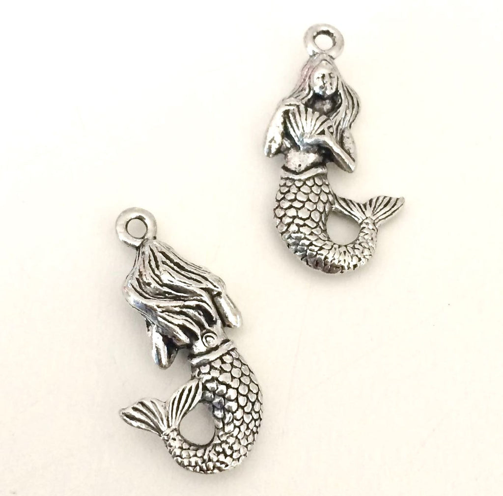 Mermaid with her scallop shell charms
