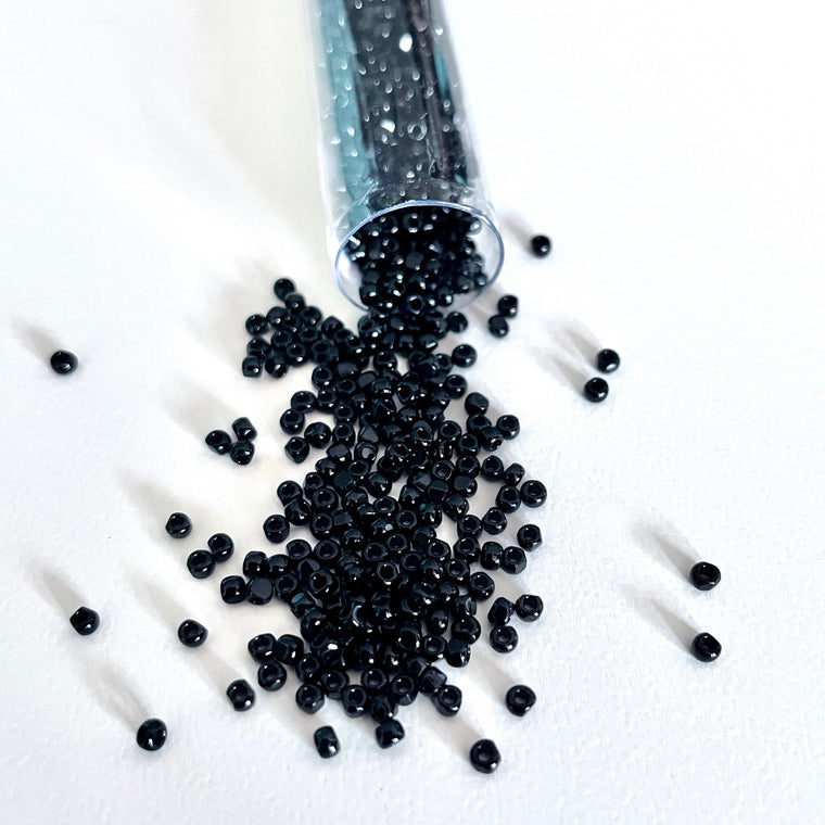 This 3-cut size 12º black seed bead looks like it just came out of the mine! With 3 tiny facets to make it sparkle like a gemstone it will add that special something to any project/Island Cove Beads & Gallery