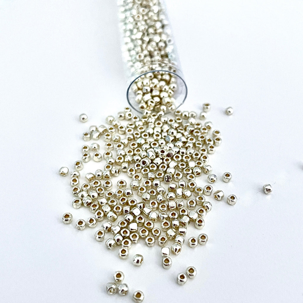The pop of metallic color in this 3-cut size 12º silver seed bead is magnificent. The 3 tiny facets pick up the light to make anything shimmer. It has a permanent finish so the color will not rub off/Island Cove Beads & Gallery