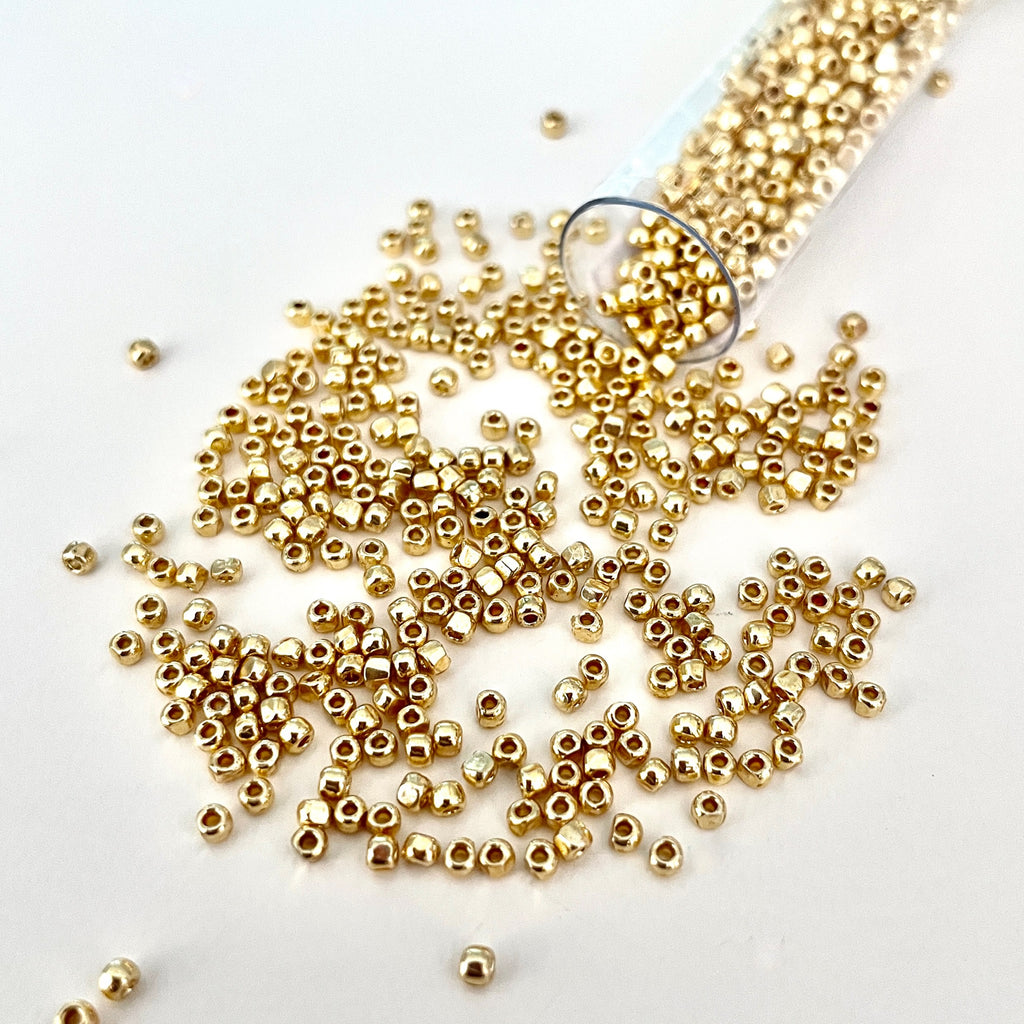 This small shimmering 3-cut size 12º seed bead has 3 tiny facets that will magnify the light like the shimmering sun/Island Cove Beads & Gallery
