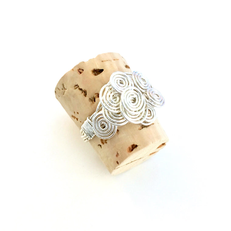 Marma Ring class, this wire ring is made up of several wires wrapped together and then each of the ends are coiled up until you have a decorative bouquet of coils/Island Cove Beads & Gallery