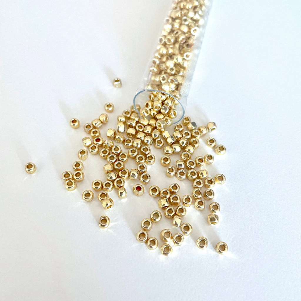 This 3-cut size 8º gold seed bead is so sparkly due to the 3 facets creating a reflection of light that causes them to shimmer like the sun/Island Cove Beads & Gallery 